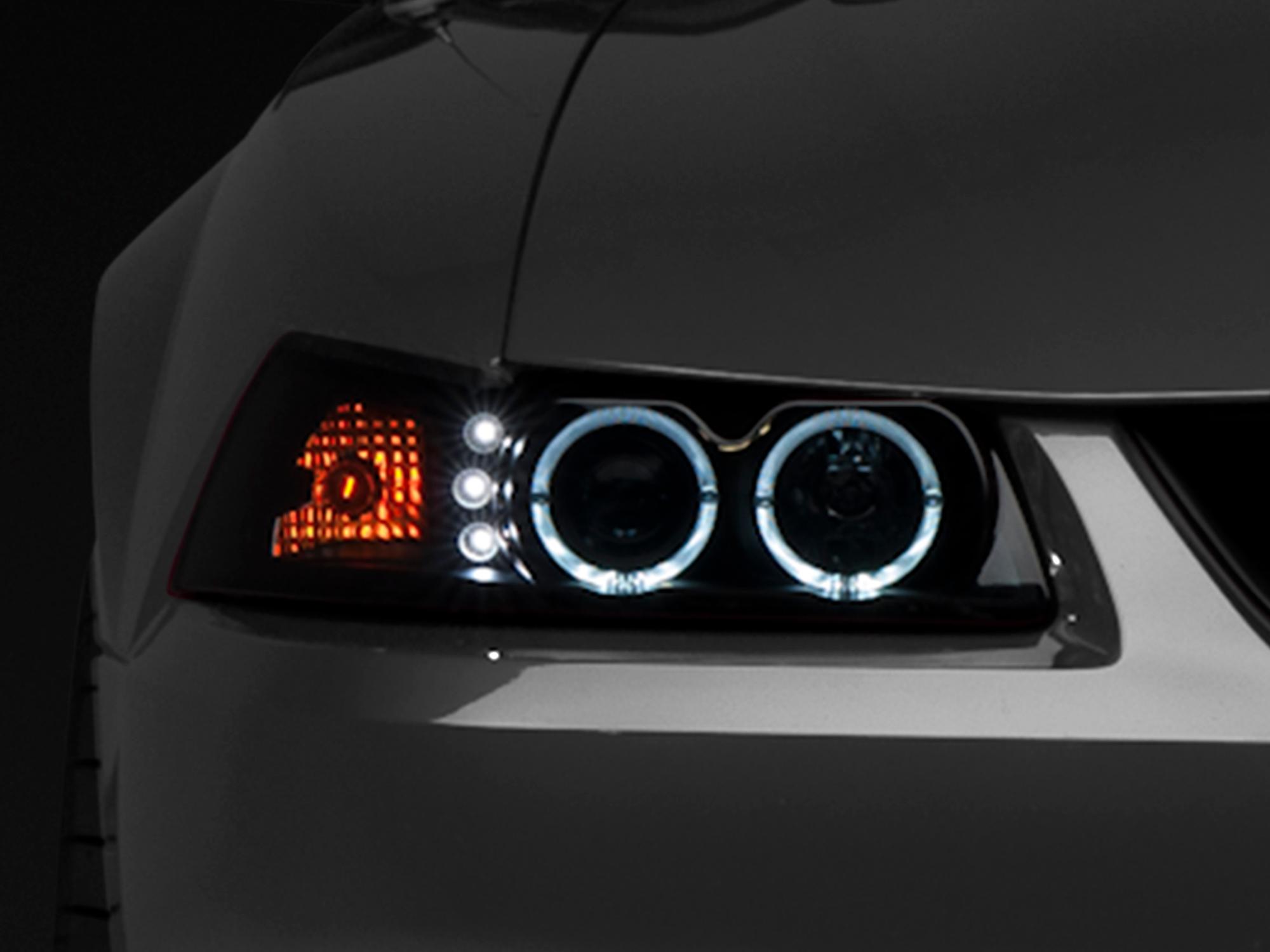 Raxiom 99-04 Ford Mustang Dual LED Halo Projector Headlights- Black Housing (Smoked Lens) - 49113