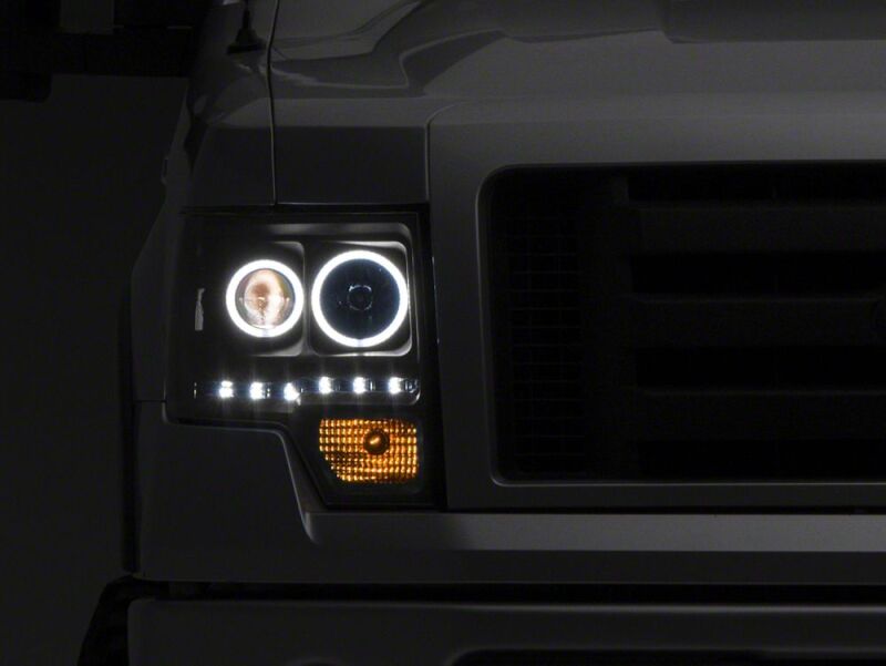 Raxiom 09-14 Ford F-150 G2 Super White LED Halo Projector Headlights- Black Housing- Clear Lens