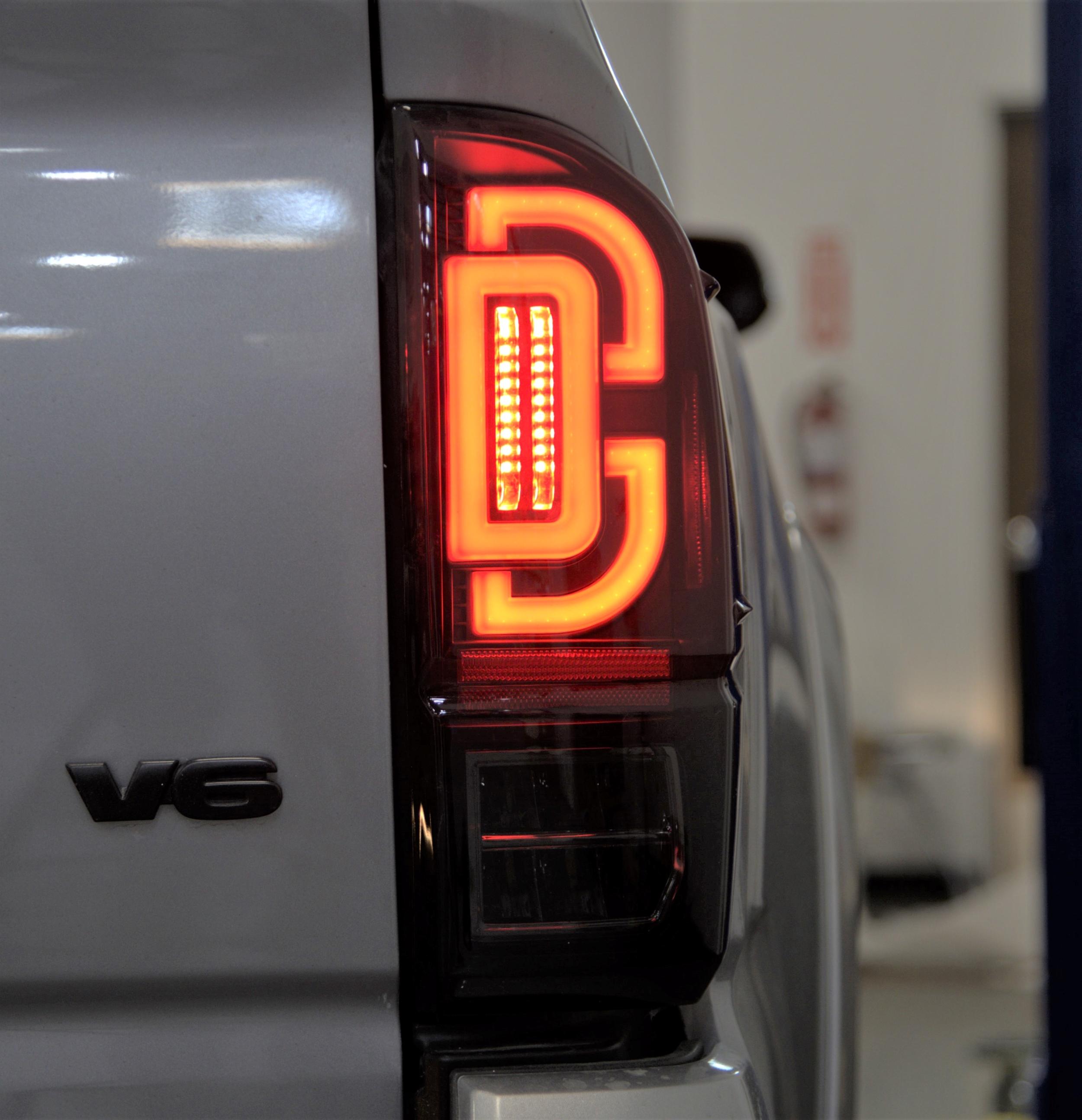 Winjet Led Sequential Tail Lights-Black / Smoke (2016-2023 Tacoma) - CTRNG0685-BS-SQ