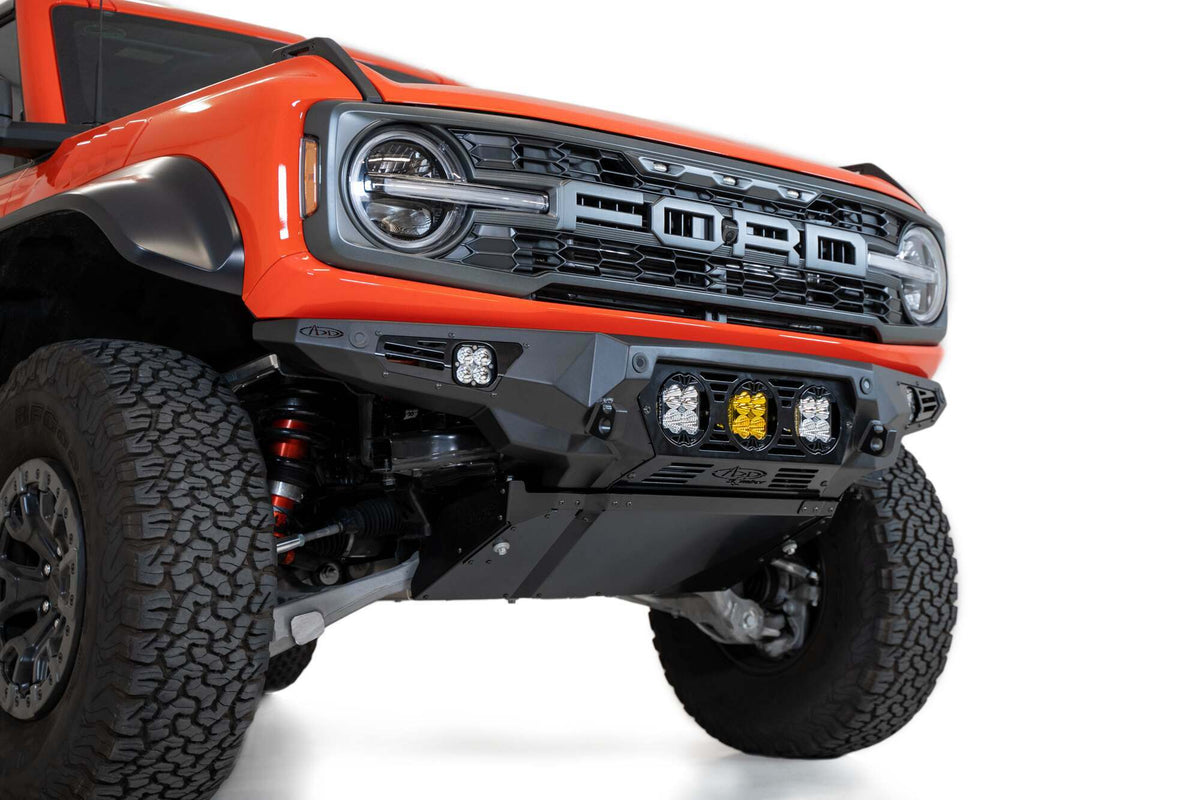 Addictive Desert Designs Ford Bronco Raptor 2022 - up Bomber Front Bumper 3 Baja Designs LP4 Mounts and Dually Mounts on Sides in Hammer Black with Satin Black panels - F260014120103