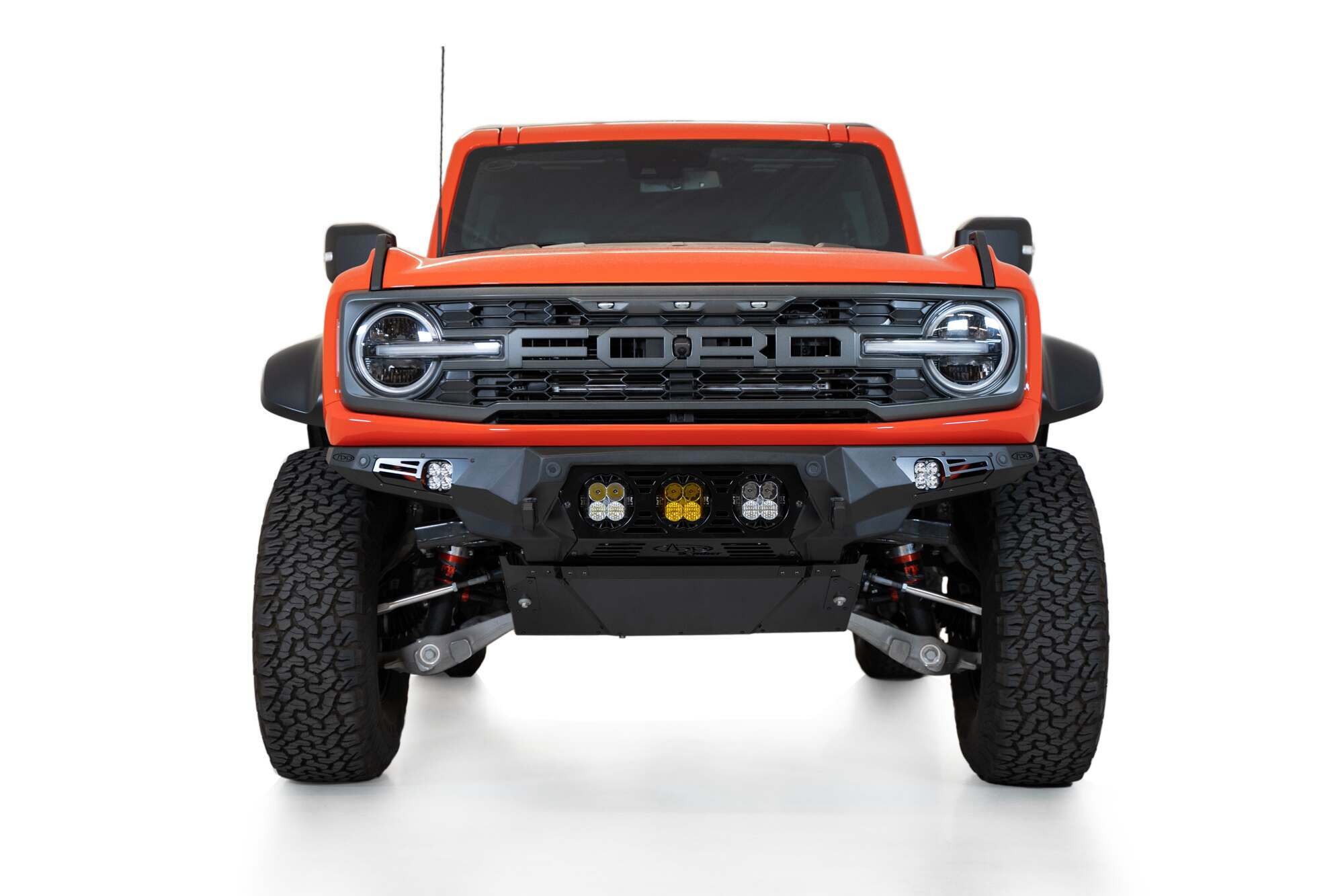 Addictive Desert Designs Ford Bronco Raptor 2022 - up Bomber Front Bumper 3 Baja Designs LP4 Mounts and Dually Mounts on Sides in Hammer Black with Satin Black panels - F260014120103