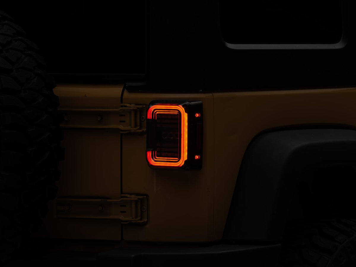 Raxiom 07-18 Jeep Wrangler JK Axial Series LED Halo Tail Lights- Black Housing (Dark Smoked Lens) - J138358