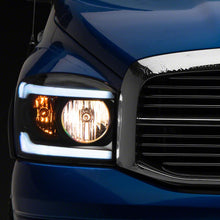 Raxiom Axial Series Headlights With Sequential Led Bar; Black Housing; Clear Lens (2006-2009 Ram 1500, Ram 2500, Ram 3500) - R131480