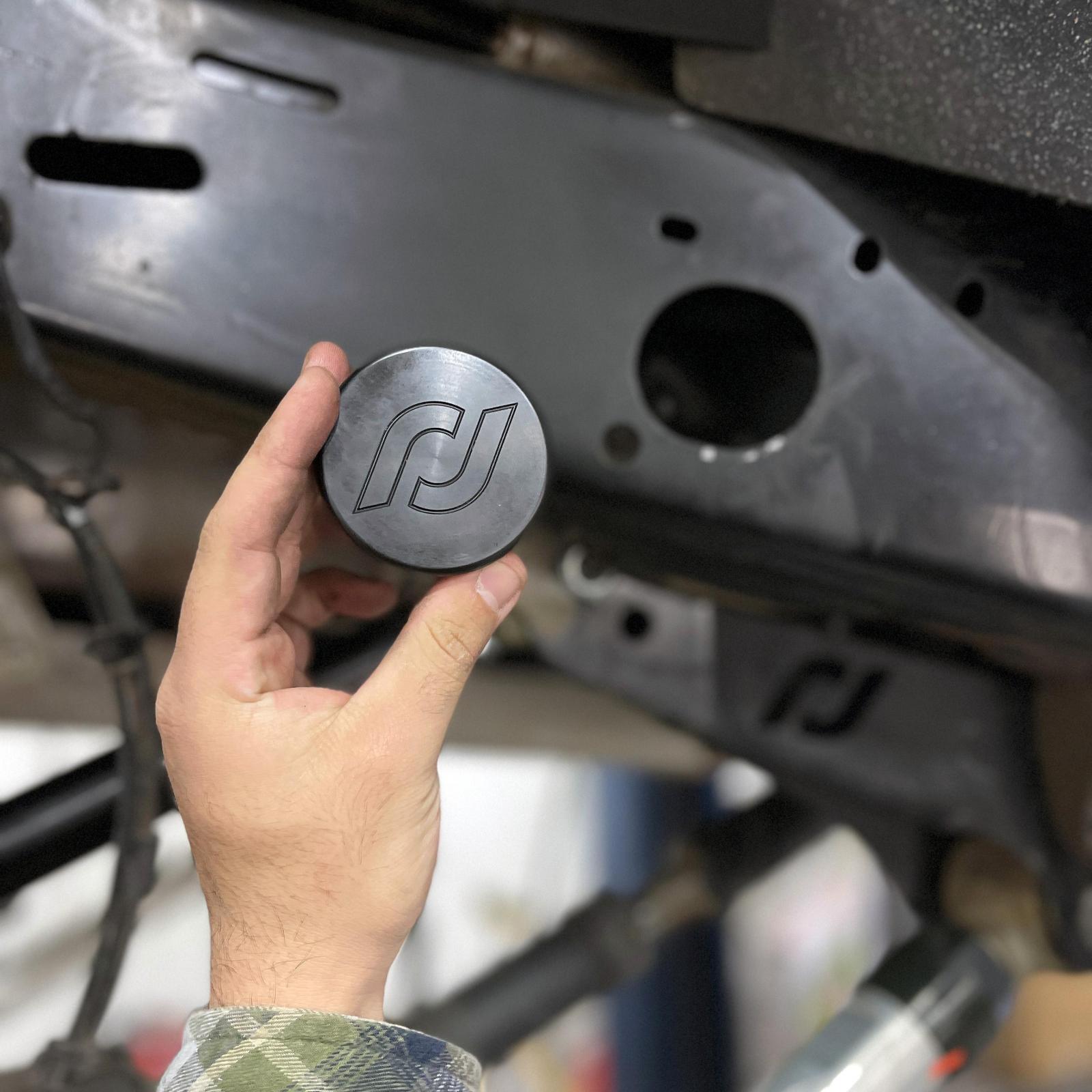 RockJock 4x4 Frame Rail Plugs for JL/JT Frame Front behind axle centerline CNC Machined Black Delrin - RJ-600000-103