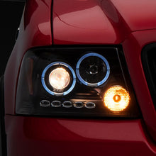 Raxiom 04-08 Ford F-150 Dual LED Halo Projector Headlights- Black Housing (Clear Lens) - T542827