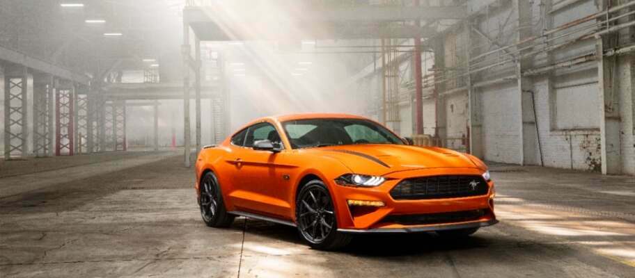 Orange 2021 Ford Mustang GT Parked in a Warehouse