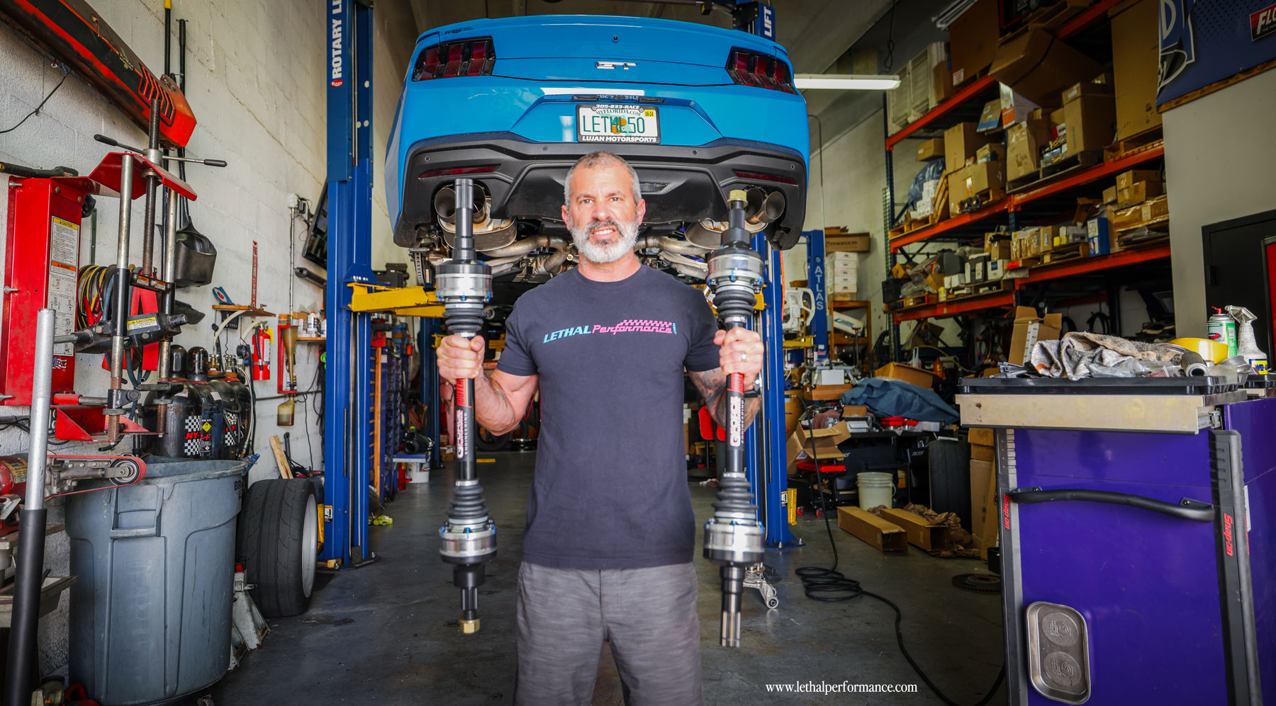 Jared holding the Outlaw G-Force axles for our 2024 Mustang GT